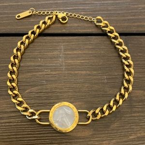 GOLD TITANIUM STEEL BRACELET ACCENTED WITH PEARL CIRCLE AND ROMAN NUMERALS